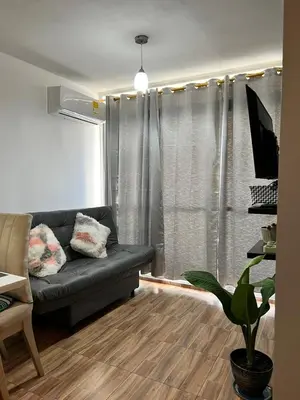a living room with a couch and a window at Moderno Rincón Urbano in Cartagena de Indias