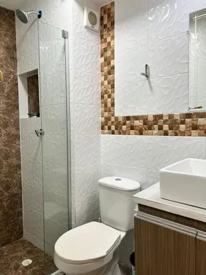 a bathroom with a toilet and a sink and a shower at Moderno Rincón Urbano in Cartagena de Indias