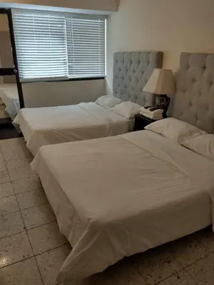 two beds in a hotel room with at Casa - EL LAGUITO in Cartagena de Indias
