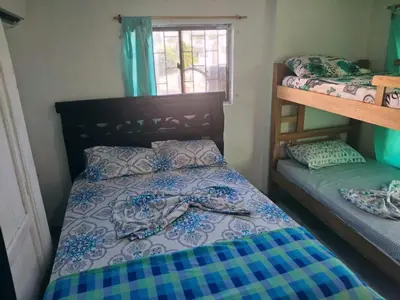a bedroom with two bunk beds and a window at Cartagena brisa y caracol in Cartagena de Indias