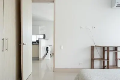 an open door leading into a bedroom with a desk at Ocean view apartment in Cartagena de Indias