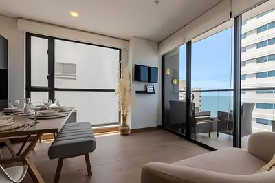 a dining room with a table and a large window at New Murano Centro/Near Walled City/Panoramic Pool in Cartagena de Indias