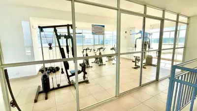 a gym with several treadying machines in a room at Apartamento en Cartagena cerca al mar in Cartagena de Indias