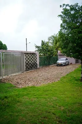 a car parked in the driveway of a house at Cabaña privada con piscina y jacuzzi junto al mar in Santa Veronica