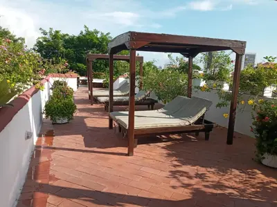 a group of beds on a patio at Casa Pizarro Hotel Boutique in Cartagena de Indias