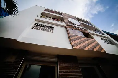 a building with a window on the side of it at Hotel San Marcos Barranquilla in Barranquilla