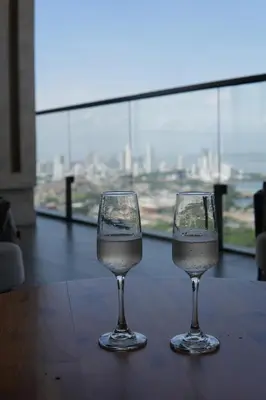 two wine glasses sitting on top of a table at Loft cercano al Centro Histórico-Cartagena in Cartagena de Indias