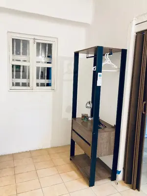 a mirror in the corner of a room with a window at Auténtico apartamento en centro histórico con arte in Cartagena de Indias