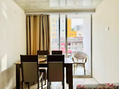 a dining room with a table and chairs and a window at Sagitario apartment at 5 minutes from the beach and old city in Cartagena de Indias