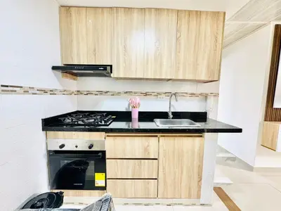 a kitchen with a stove and a sink at Sagitario apartment at 5 minutes from the beach and old city in Cartagena de Indias