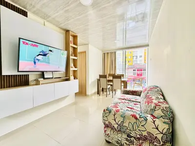 a living room with a couch and a flat screen tv at Sagitario apartment at 5 minutes from the beach and old city in Cartagena de Indias