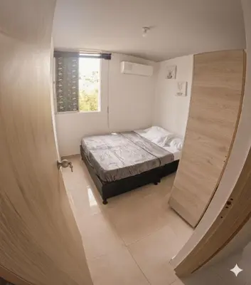 a small bedroom with a bed and a window at Fenix, Apartamento En Coveñas, Primer piso, 103 in Coveñas