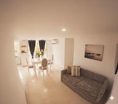 a living room with a couch and a table at Fenix, Apartamento En Coveñas, Primer piso, 103 in Coveñas