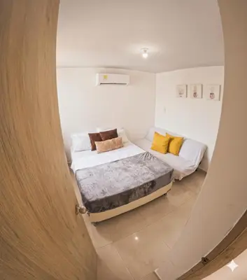 a bedroom with two beds in a room at Apartamento Caribeño 1203 in Coveñas