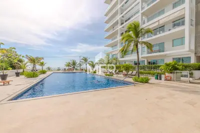 a swimming pool in front of a building at Morros 3, Beachfront & 2 Bedrooms in Cartagena de Indias