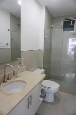 a bathroom with a toilet and a sink and a shower at NOK Oceanside getaway in Cartagena in Cartagena de Indias