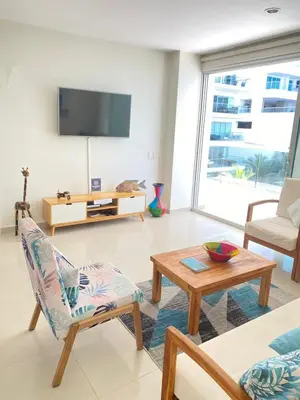a living room with a tv and a table at NOK Oceanside getaway in Cartagena in Cartagena de Indias
