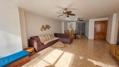 a living room with a couch and a ceiling fan at Apt 3 rooms Laguito Cartagena 1 block from the beach in Cartagena de Indias