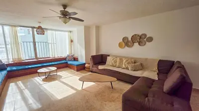 a living room with a couch and a ceiling fan at Apt 3 rooms Laguito Cartagena 1 block from the beach in Cartagena de Indias