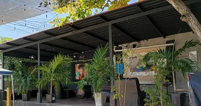 a building with a bunch of plants in front of it at Posada mary in Cartagena de Indias