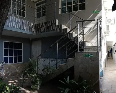a building with a staircase in front of a building at Posada mary in Cartagena de Indias
