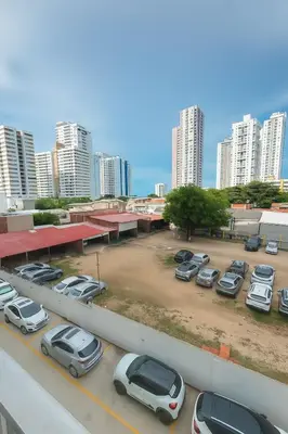 a parking lot with parked cars in a city at Cartagena Apartamento completo vista al mar in Cartagena de Indias