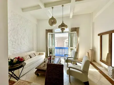 a living room with a couch and a table at By Calamari Homes - Ayos 206 - Walled City in Cartagena de Indias