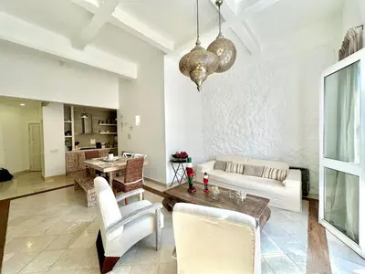 a living room with a couch and a table at By Calamari Homes - Ayos 206 - Walled City in Cartagena de Indias