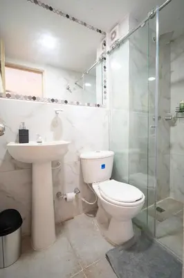 a bathroom with a toilet and a sink and a shower at Aqualina 209 y 512 in Cartagena de Indias