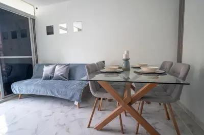 a dining room with a glass table and chairs at Aqualina 209 y 512 in Cartagena de Indias