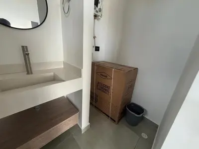 a box sitting in a bathroom next to a room at Delux Suite Coral Tower in Barranquilla