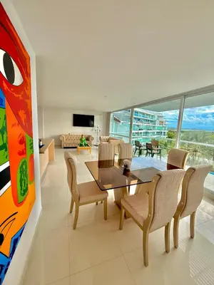 a dining room with a table and chairs at Karibmed Cartagena in Cartagena de Indias