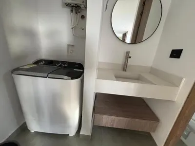 a small bathroom with a sink and a mirror at Deluxe Suite with Terrace in Barranquilla
