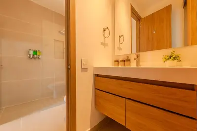 a bathroom with a sink and a shower at Cartagena getaway - Laguna Cristalina - 2BR - 7 pax in Cartagena de Indias
