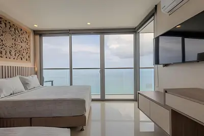 a bedroom with a bed and a large window at 