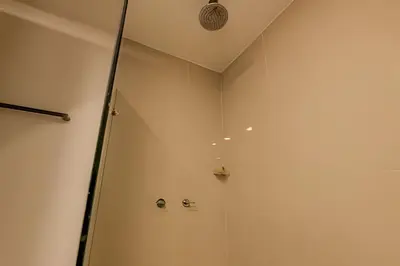 a shower with a glass door in a bathroom at 