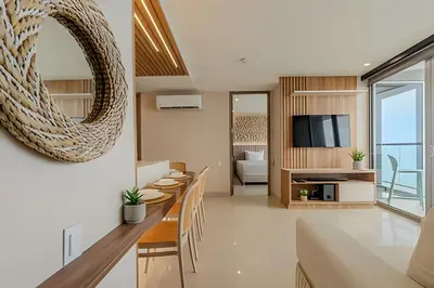 a living room with a table and chairs and a television at 