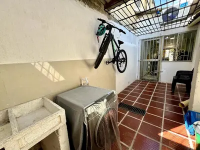 a bike hanging on the wall of a room at Moderno apartamento privado con parqueadero in Barranquilla