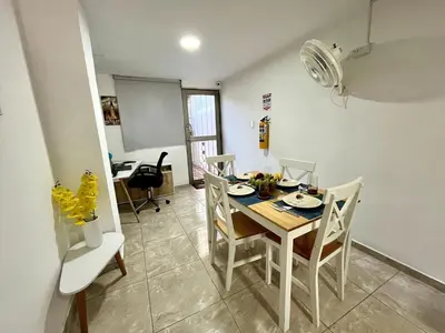 a dining room with a table and chairs at Moderno apartamento privado con parqueadero in Barranquilla