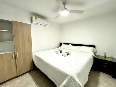 a bedroom with a bed with two towels on it at Moderno apartamento privado con parqueadero in Barranquilla