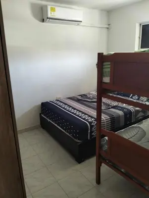 a bedroom with two bunk beds in a room at La casa de la abuela cartagena in Cartagena de Indias