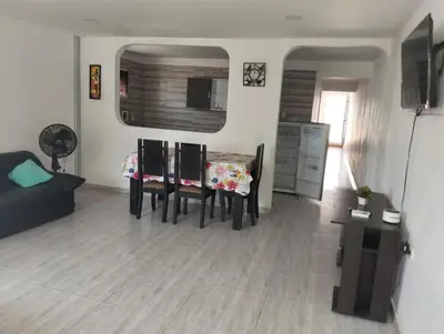 a living room with a couch and a table and chairs at La casa de la abuela cartagena in Cartagena de Indias