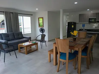 a living room with a couch and a table at Palmar in Playa Dormida