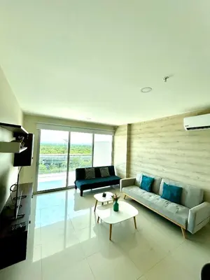 a living room with a couch and a table at Apartamento Cartagena in Cartagena de Indias