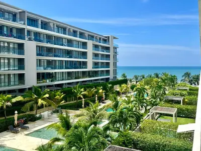 a view of a hotel with palm trees and the ocean at Spectacular view of the Caribbean Sea in Cartagena de Indias