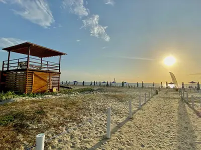 a beach with a lifeguard tower on the beach at Spectacular view of the Caribbean Sea in Cartagena de Indias