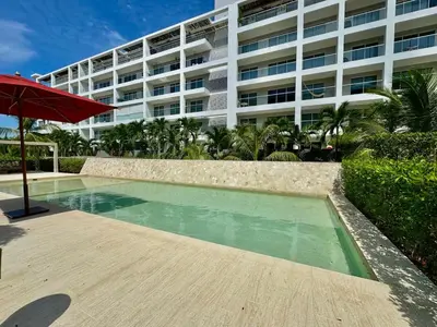 a swimming pool in front of a large building at Spectacular view of the Caribbean Sea in Cartagena de Indias