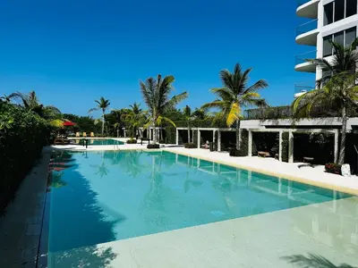 a large swimming pool in front of a building at Spectacular view of the Caribbean Sea in Cartagena de Indias