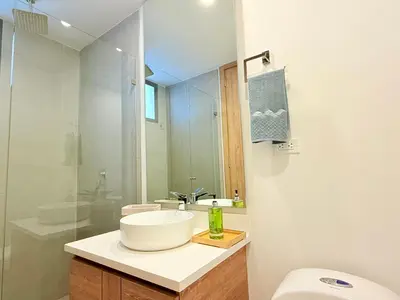 a bathroom with a sink and a toilet and a mirror at Premium Apartment - Beachfront - Luxury condo in Cartagena de Indias