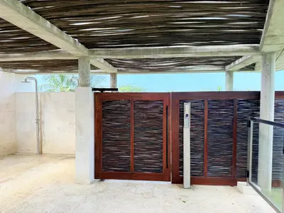 a wooden door with wooden blinds on a house at Premium Apartment - Beachfront - Luxury condo in Cartagena de Indias